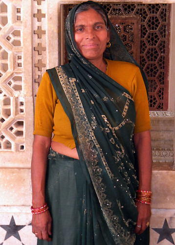 Woman posing in front of Akbar's Mausoleum in Agra, India