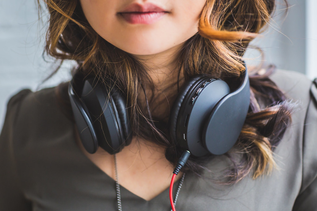 Close Up Shot of Girl Wearing Black Wired Headphones