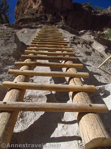 Preparing to climb one of the ladders up to Alcove House in Bandelier National Monument, New Mexico
