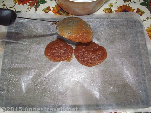 Spoon applesauce onto the prepared baking sheet to make dried applesauce