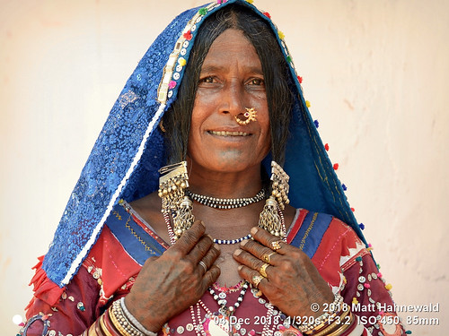banjara lambadi gor gormati scheduledtribe matthahnewaldphotography facingtheworld people character face chintattoo tattoo eyes nosejewelry jewelry silver expression hairstyle traditional clothing headscarf dupatta bodylanguage gesture bothhands consent respect concept humanity living travel culture tradition anthropology exotic ethnic tribal photoshoot benaulim goa india indian gypsy lamani individual oneperson female elderly woman physiognomy nikond610 nikkorafs85mmf18g 85mm 4x3ratio resized 1200x900pixels horizontal portrait halflength closeup fullfaceview posingcamera smiling series 3of3 bangles dress ring clarity lookingatcamera colourful colour