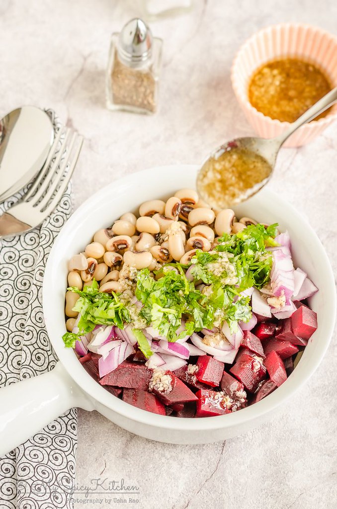 Bowl of healthy beets salad with black eyed peas.