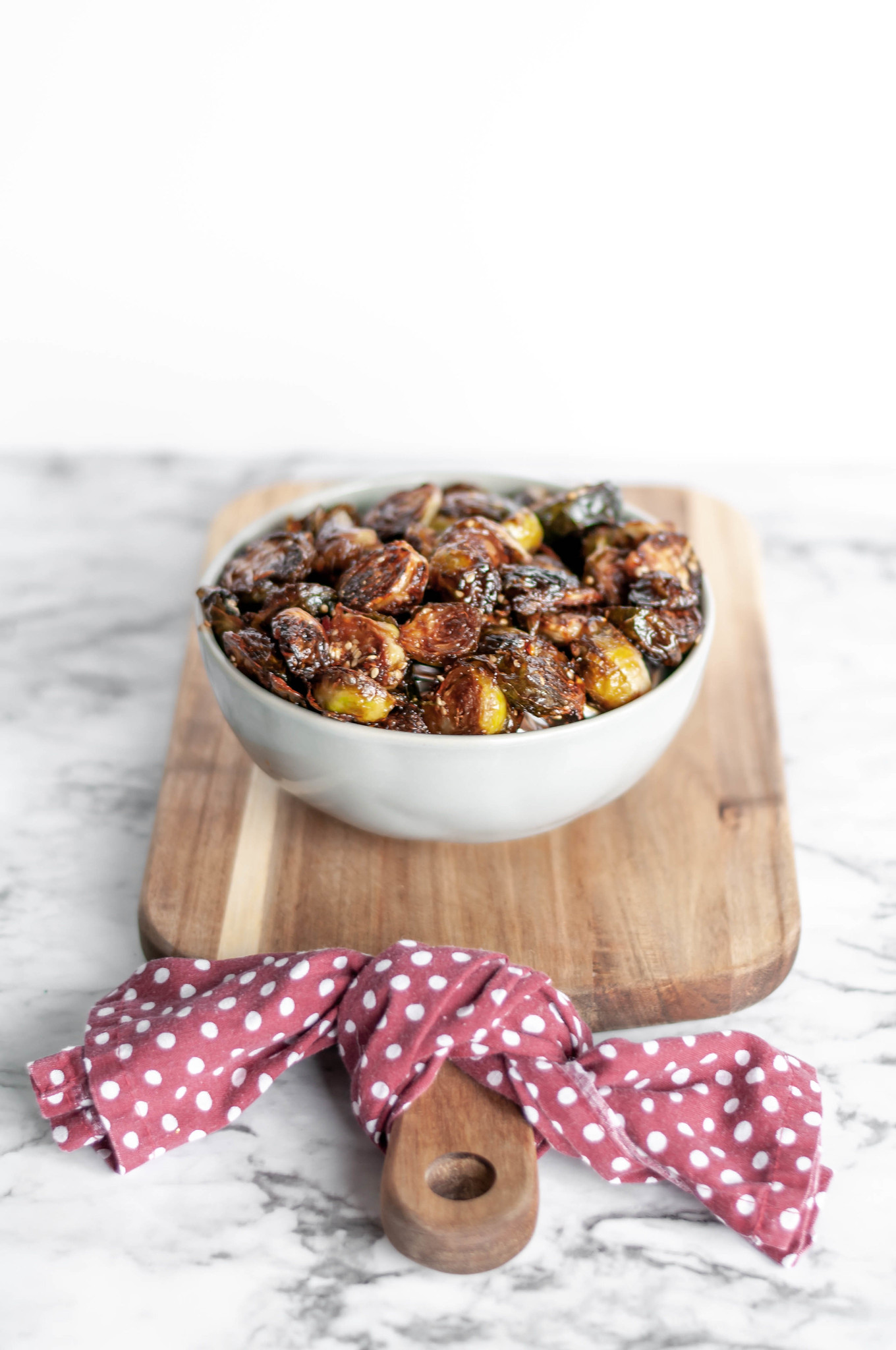 Thai Sweet Chili Brussels Sprouts are going to be your new favorite Thanksgiving side dish. Roasted in the oven to crispy, sweet perfection.